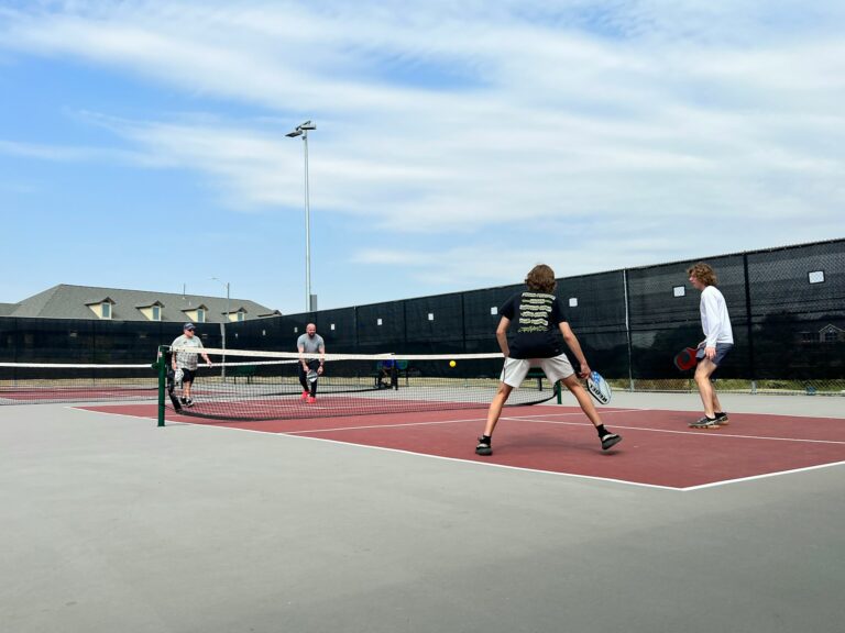 playing a game and following pickleball rules and regulations